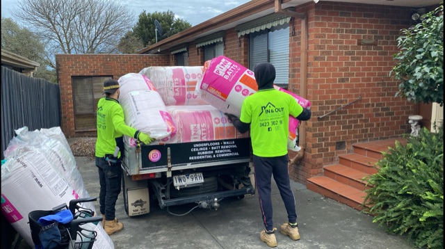 In & Out Insulation crew unloading pink batts from the ute at a Melbourne home